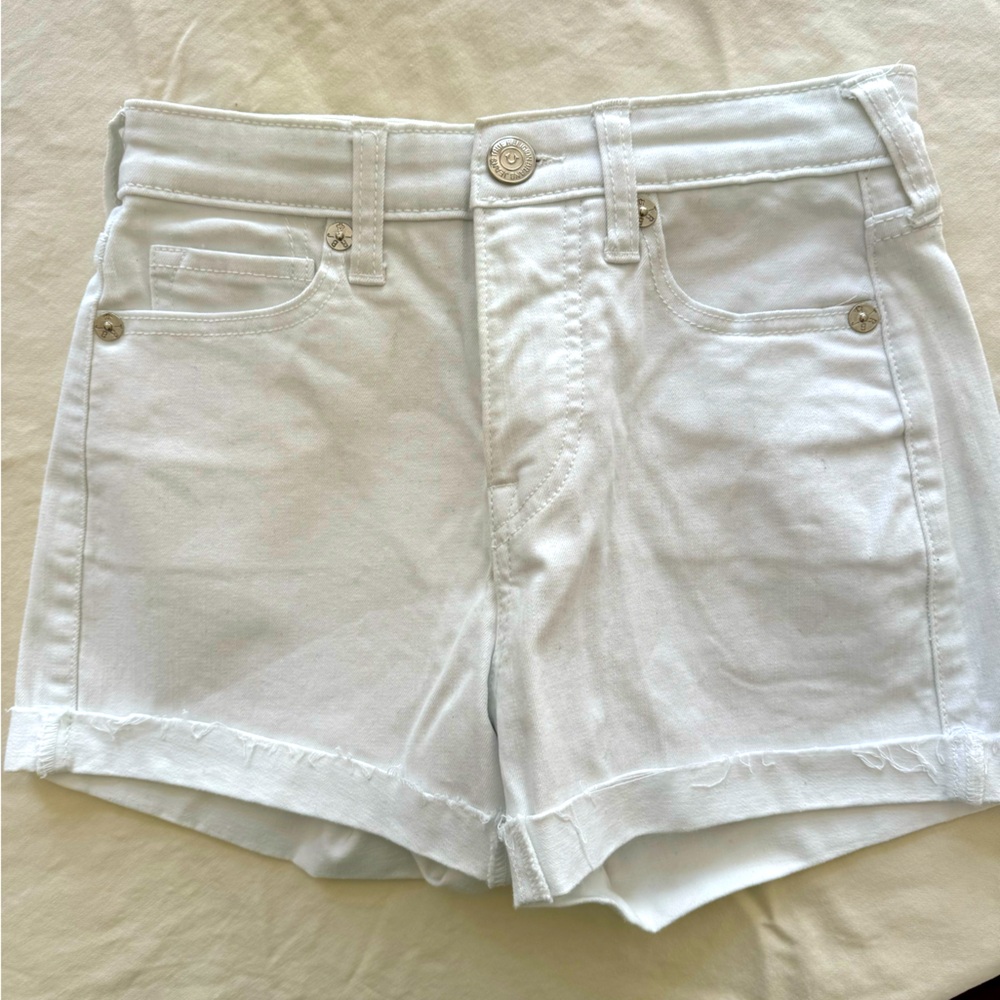 This is a pair of True Religion Jennie Curvy mid rise shorts in white.